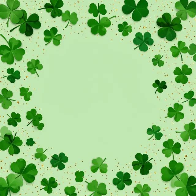 A pale green background framed by scattered shamrocks and tiny gold glitter sparkles with empty central copy space