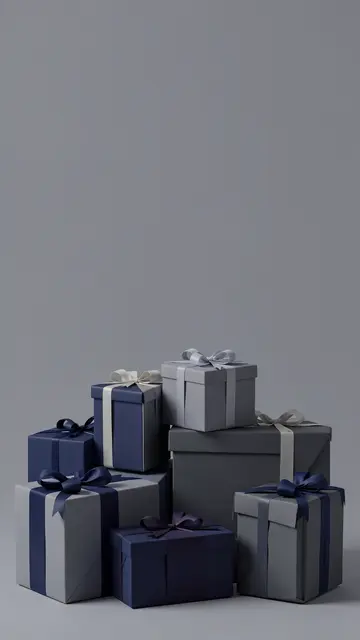 Stacked navy and slate gray gift boxes sit at the bottom of a vertical frame with empty copy space above.