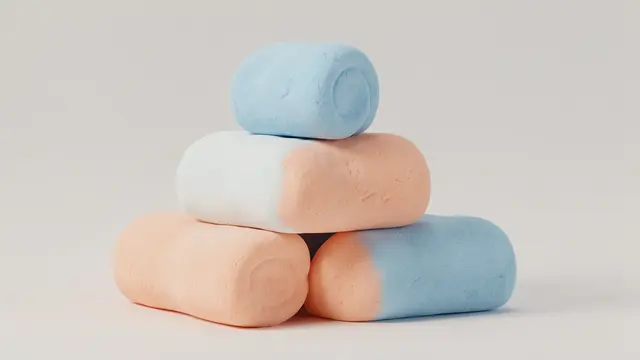 Pyramid stack of soft rounded peach and sky blue marshmallow-like 3D forms against a neutral light gray background