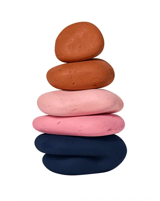 A vertical stack of smooth rounded organic forms in terracotta, pink, and navy against a plain white background