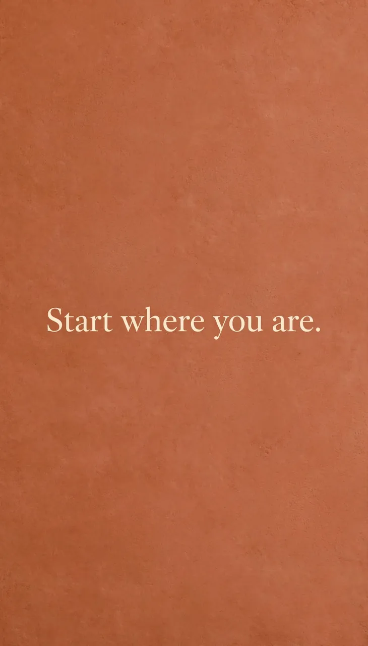 Centered cream serif text reading "Start where you are." on a warm terracotta textured vertical background