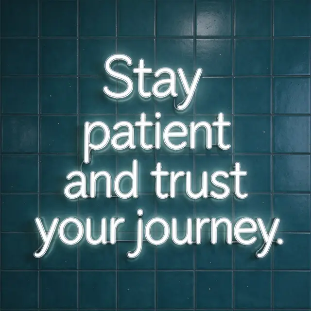 Glowing white neon sign reading "Stay patient and trust your journey." mounted on a dark teal tiled wall.
