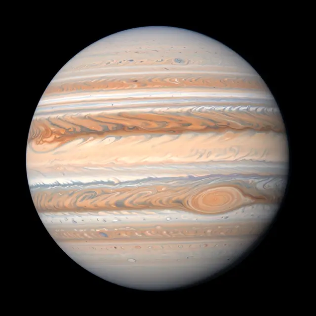 Detailed view of the planet Jupiter showing its characteristic swirling atmospheric bands against black space