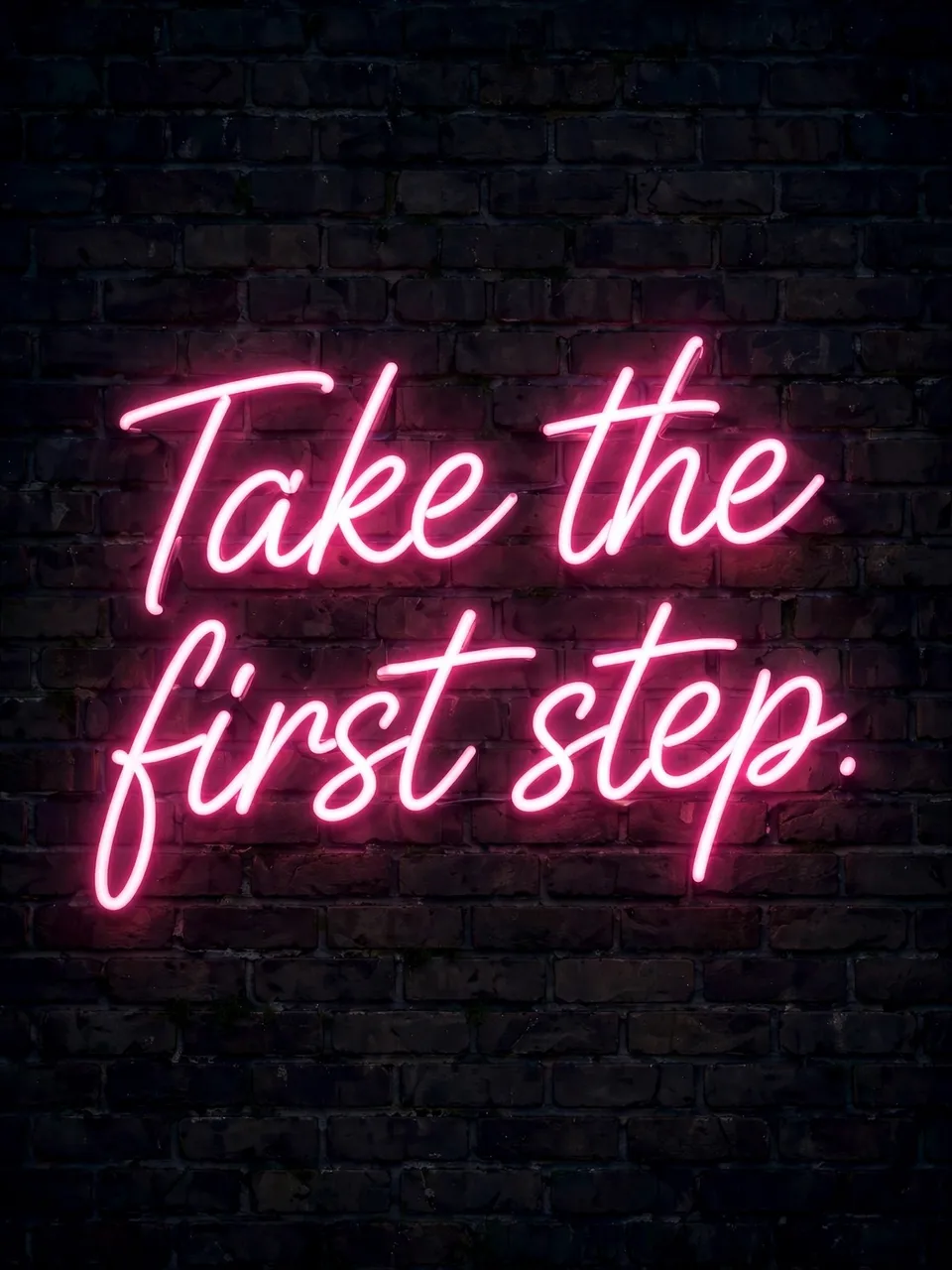 Glowing pink neon sign reading "Take the first step." mounted on a dark nighttime brick wall