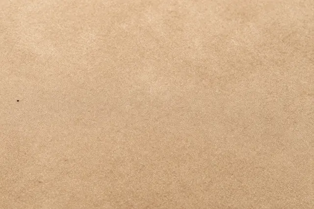 Full frame close up of soft tan suede with a fine brushed nap texture