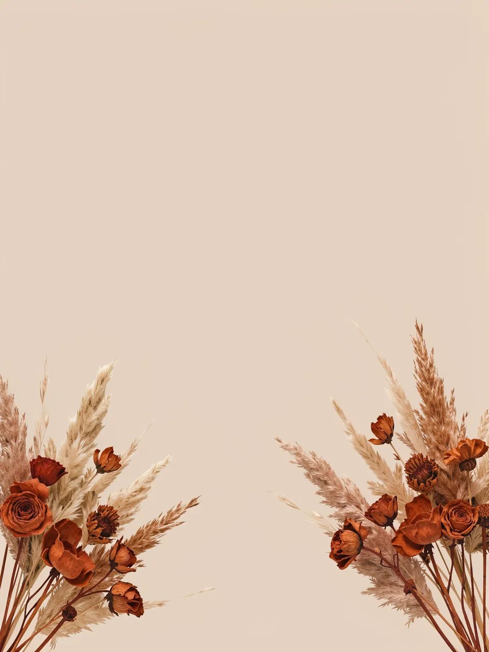 Dried terracotta flowers and pampas grass placed in opposite bottom corners of a plain beige background