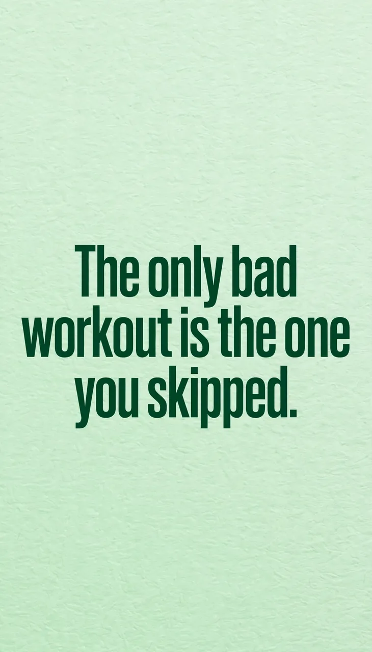 Bold dark green text reading "The only bad workout is the one you skipped." centered on a textured fresh mint green