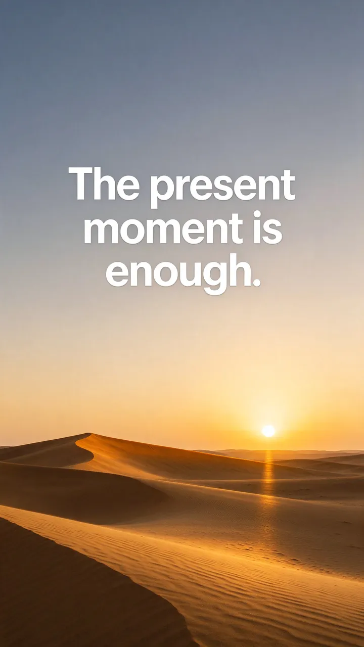 Sunset over golden desert dunes with white text reading "The present moment is enough." as a phone wallpaper
