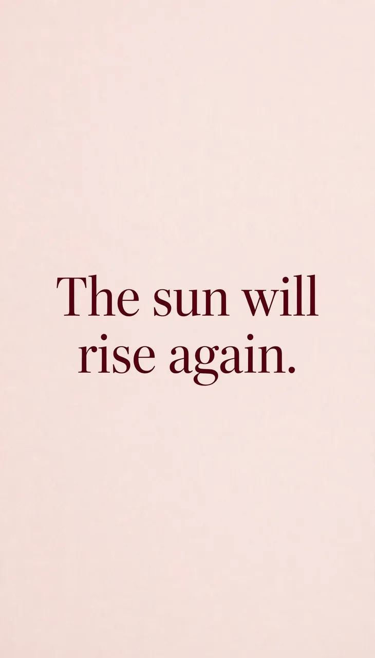 Centered deep burgundy serif text reading "The sun will rise again." on a soft blush pink background