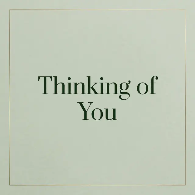 Centered "Thinking of You" dark green serif text inside a thin gold frame on a soft sage green background