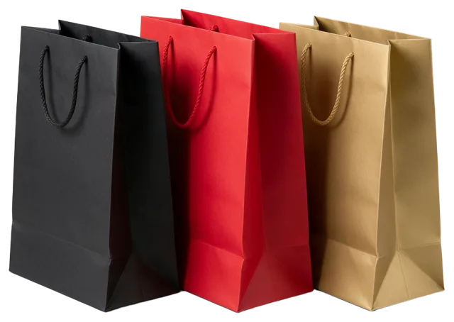 Standing unprinted paper shopping bags in black, red, and gold with rope handles