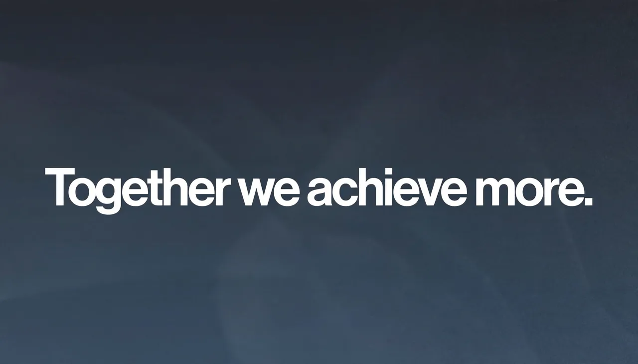 Bold white sans-serif text reading "Together we achieve more." centered on a dark slate blue gradient desktop wallpaper
