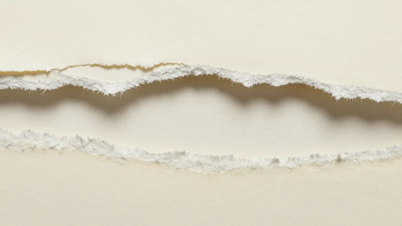 Close-up of layered torn cream paper edges with fibrous frayed borders and soft shadow depth