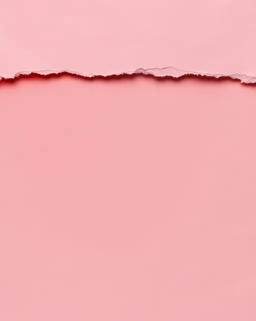 Soft pink paper with a ragged torn horizontal edge revealing a darker red shadow below the top layer.