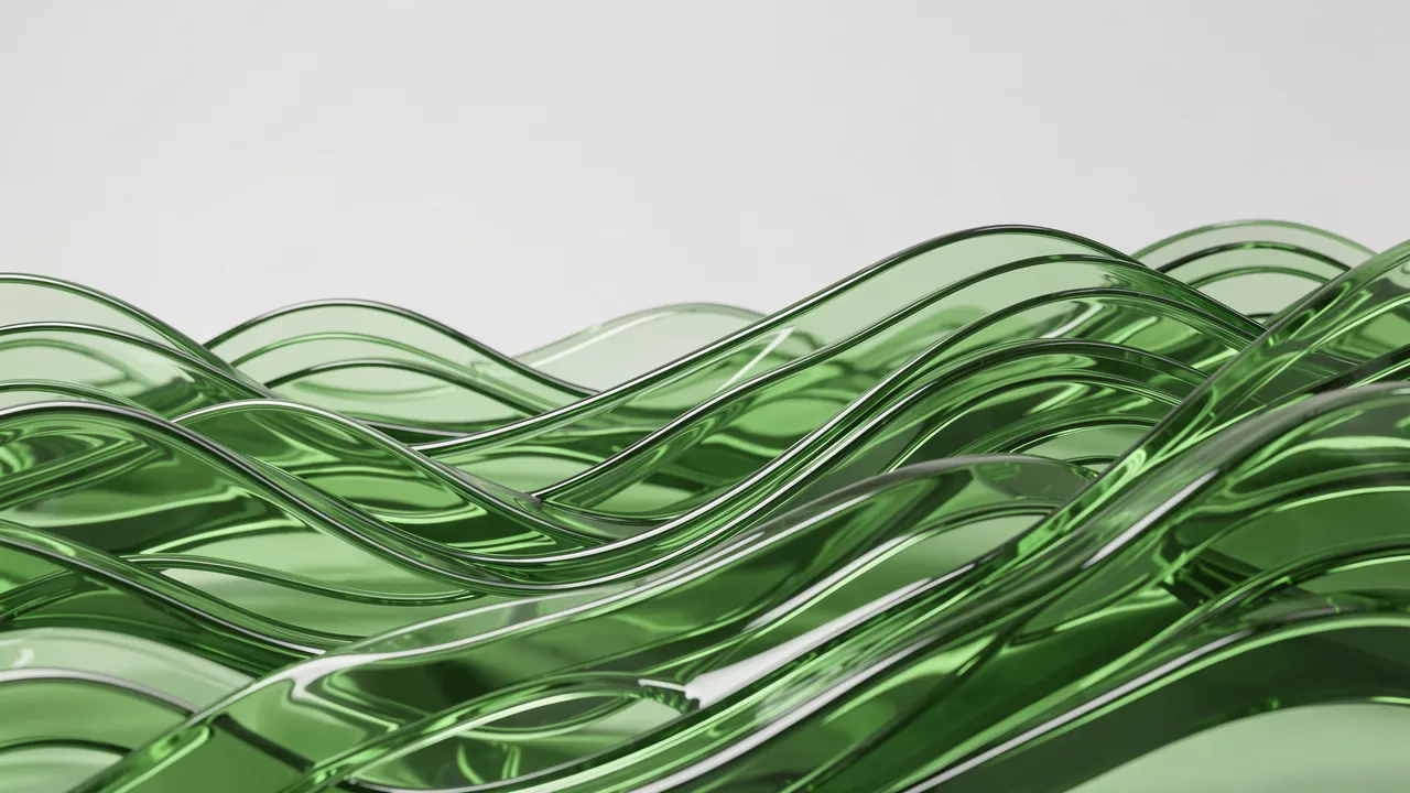 Stacked rolling translucent green glass waves sit against a pale neutral background under soft studio lighting