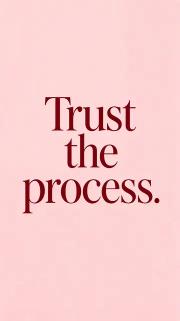 Centered deep burgundy serif text reading "Trust the process." on a soft blush pink vertical background.