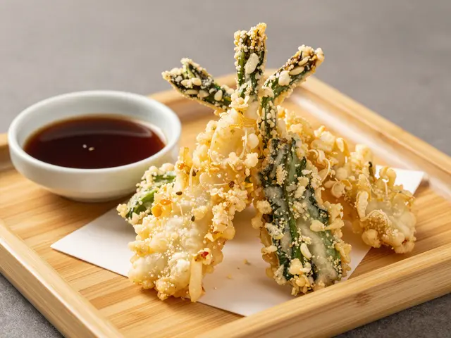 Crispy vegetable tempura sits on a bamboo tray next to a small bowl of dark dipping sauce.