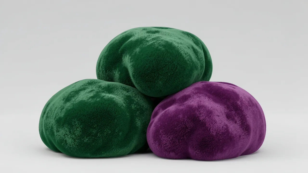 Three soft fuzzy velvet blobs in emerald green and plum purple rest grouped against a light gray background