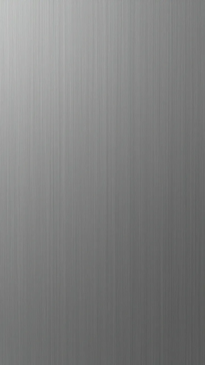Full frame close-up of cool gray brushed titanium with fine vertical directional grain