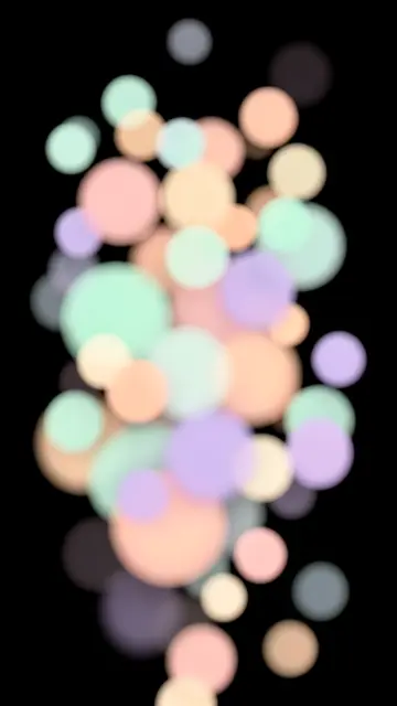 Soft overlapping mint, peach and lilac bokeh circles arranged vertically on a solid pure black background