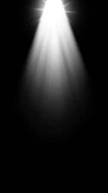 A vertical cool white spotlight flare with soft fanning rays extends down from the top against solid black