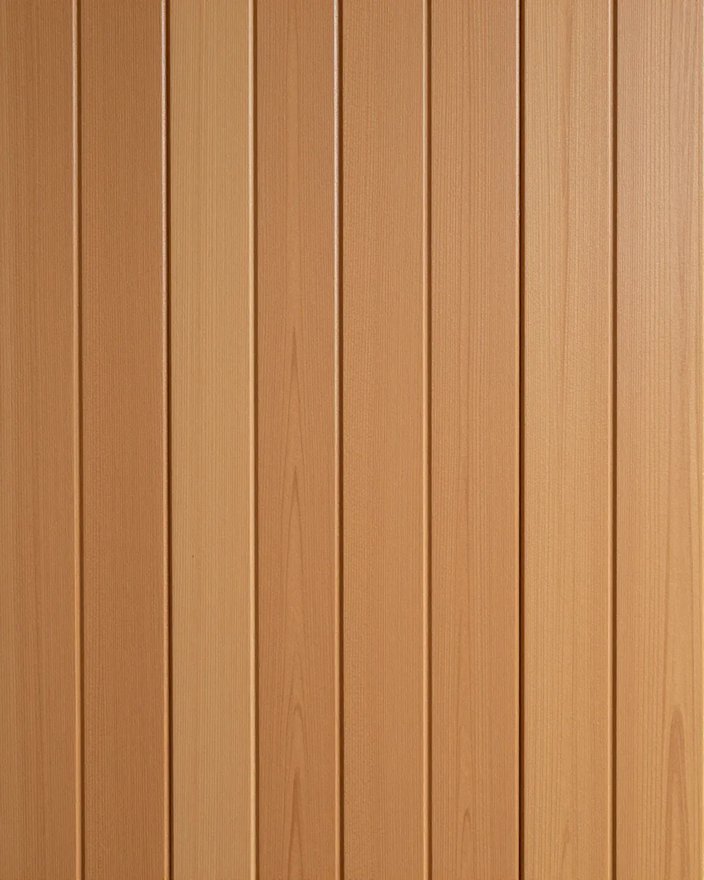 Full frame close-up of warm brown vertical wood paneling with narrow upright grooves and even lighting.