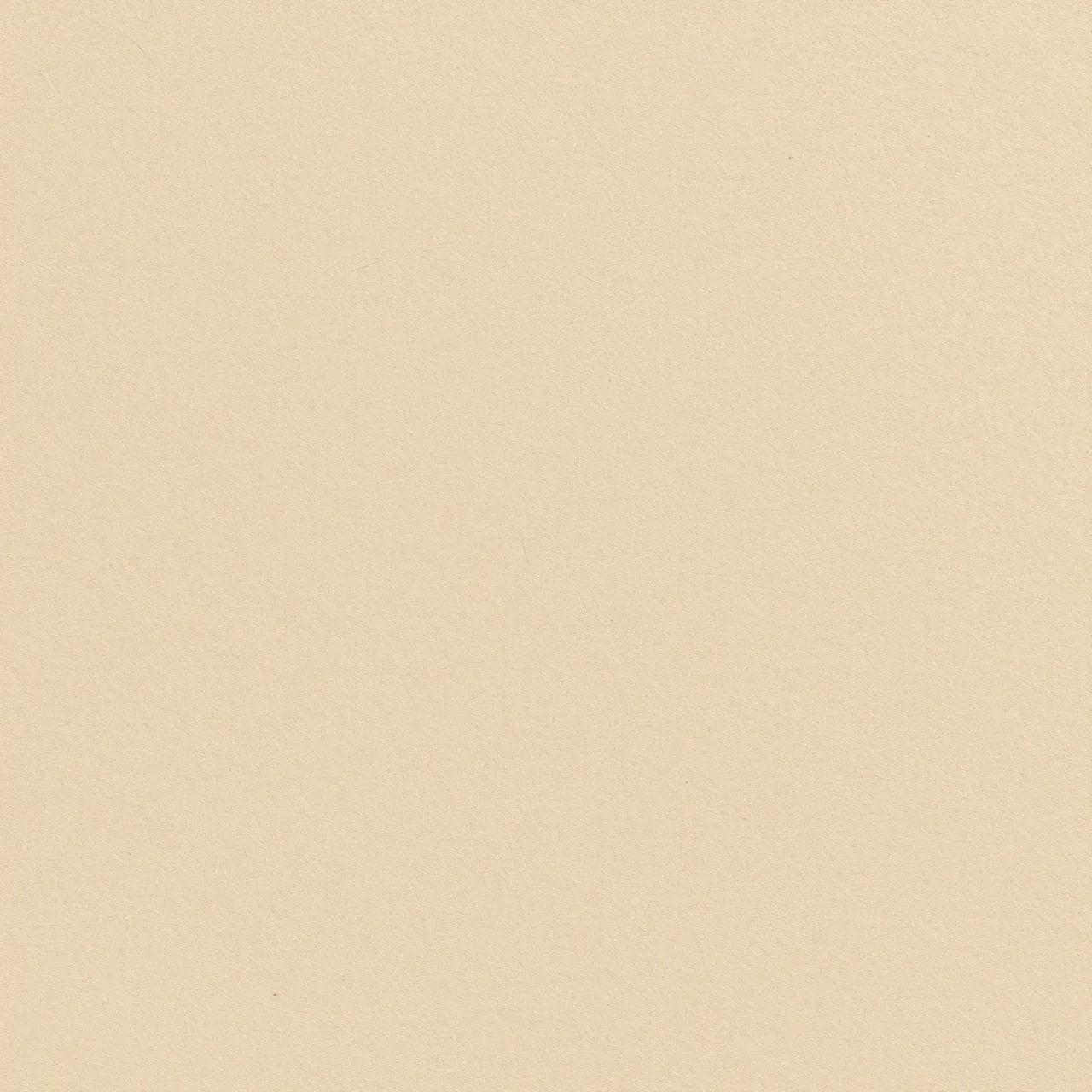 Full frame even close-up of warm tan beige paper surface with subtle fine fibers and specks