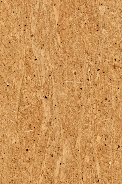 Full frame macro close-up of warm honey-toned cork surface with fine scattered pores