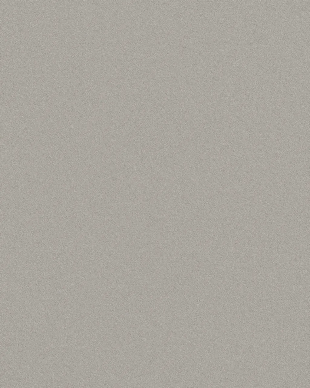 Full frame close-up of fine gritty tooth warm gray sanded pastel paper under even flat lighting