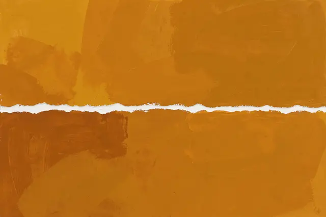 An abstract painting of layered warm orange and brown brushstrokes split horizontally by a rough torn white edge