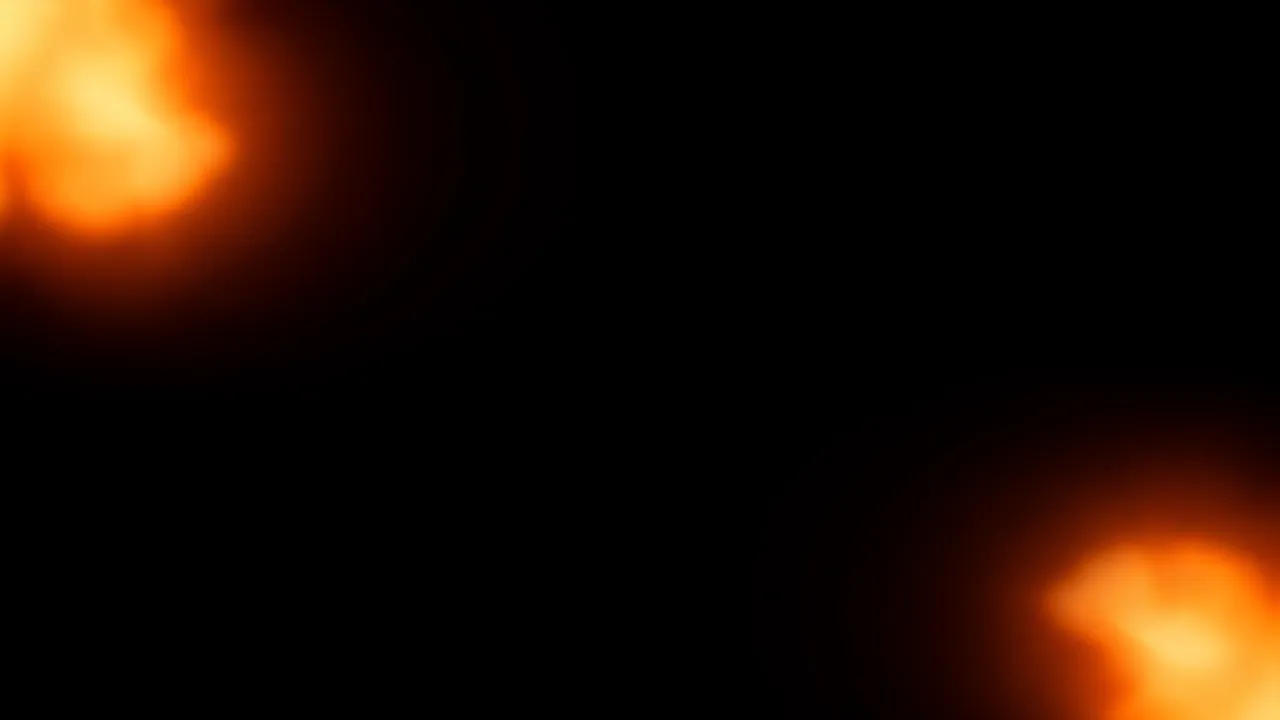 Soft glowing orange light leaks sit in opposite corners of a solid black background