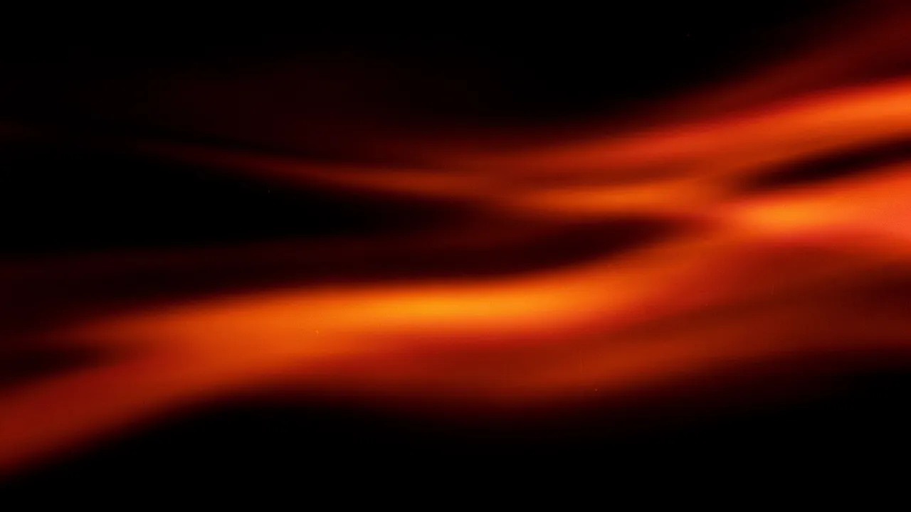 Soft streaking orange and red film light leaks drift across a solid black background