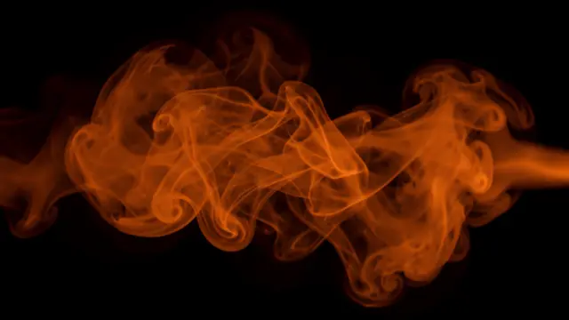 Backlit wispy orange smoke swirls across a solid pure black background