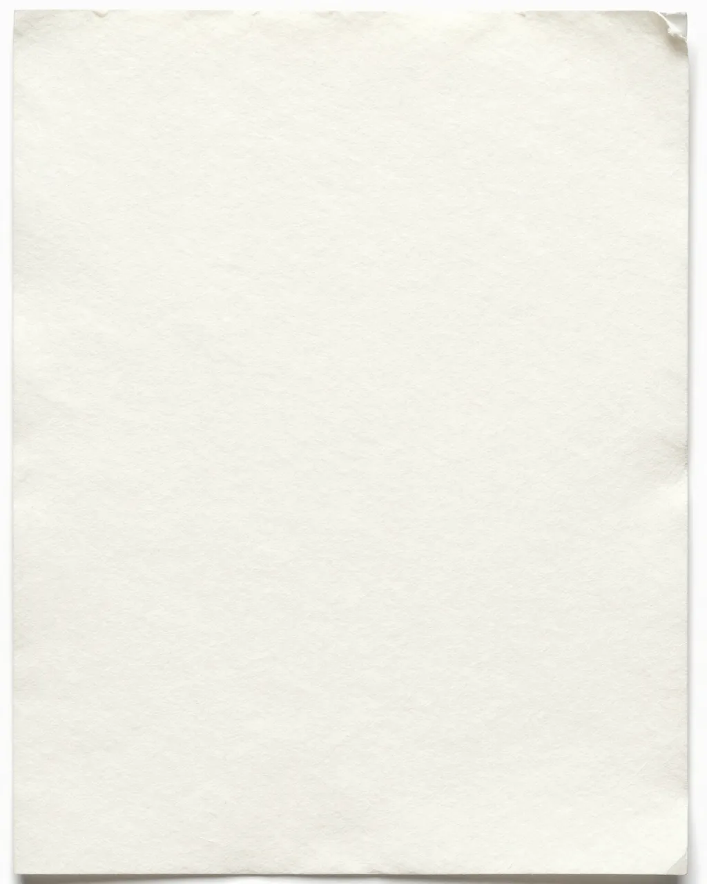 Full frame close-up of warm white cotton rag paper with soft deckled edges and loose natural fibers