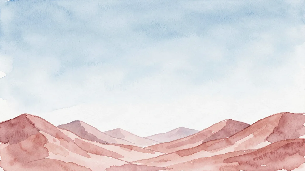 Soft watercolor dusty pink desert hills sit below a pale open light blue sky with ample empty copy space