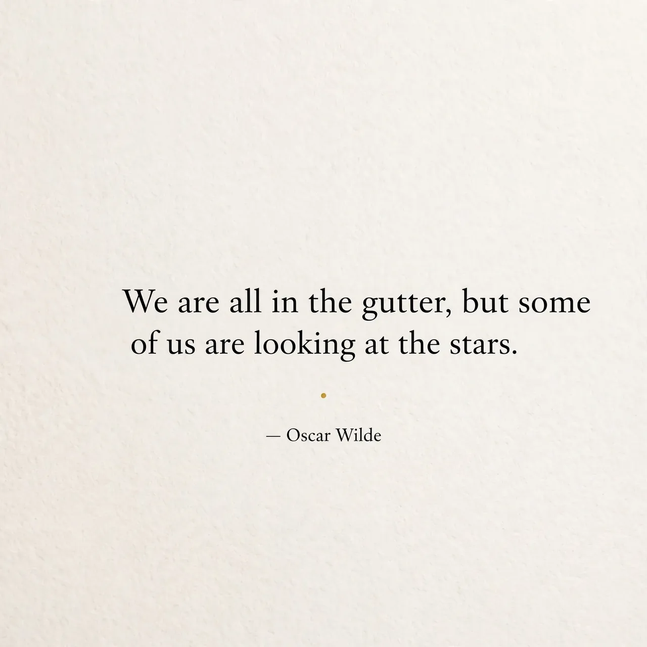 Minimalist quote card with off-white textured background, black serif text, small gold dot divider, reading "We are all in