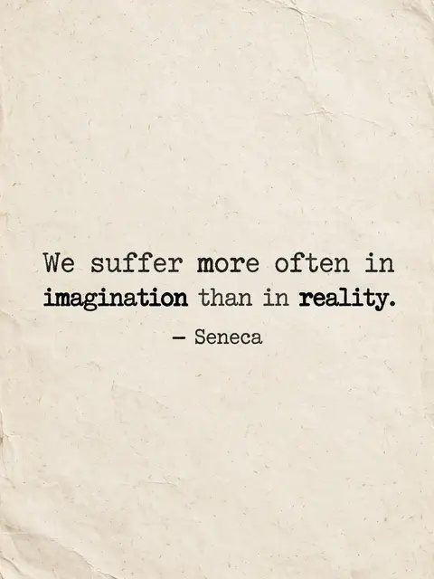 Typewritten quote "We suffer more often in imagination than in reality" by Seneca printed on crumpled warm off-white paper