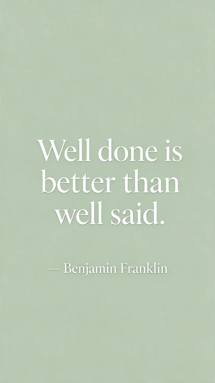 Minimalist sage green phone wallpaper displaying the quote "Well done is better than well said. — Benjamin Franklin" in