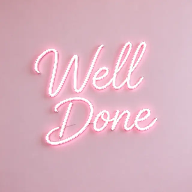 Glowing white neon script sign reading "Well Done" mounted on a solid pale pink wall