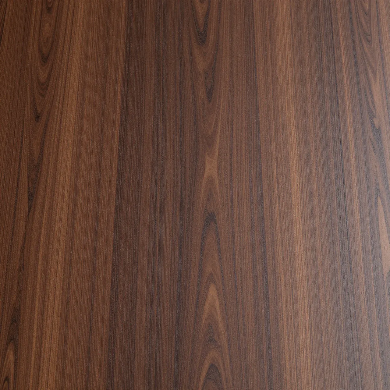 Full frame close-up of wenge wood surface with warm brown tones and fine dark grain lines