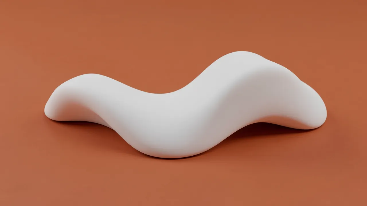 A smooth matte white wave-shaped 3D form rests on a solid terracotta surface