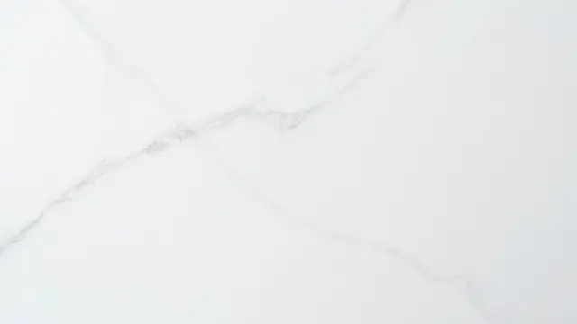 Full frame view of smooth white marble with soft flowing gray veins
