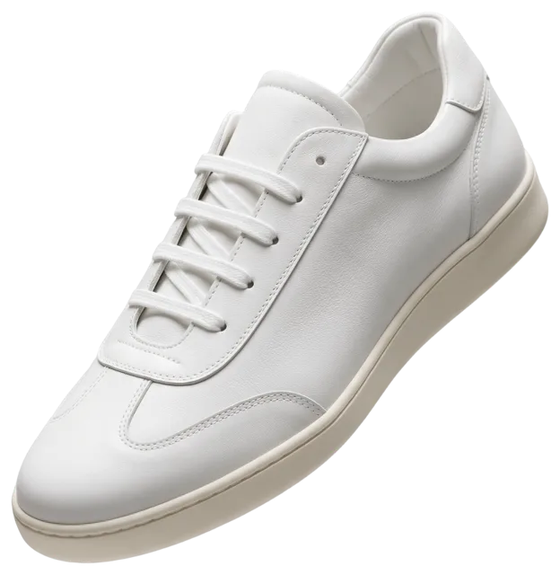 Single clean white minimalist leather sneaker with a cream sole shown in three-quarter side view