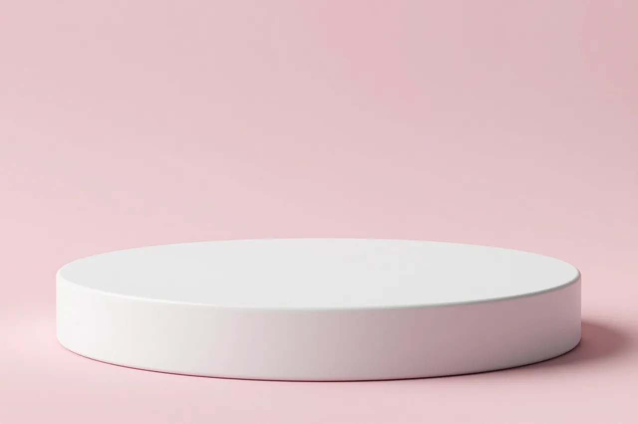A smooth round white product podium sits against a solid pastel pink background.