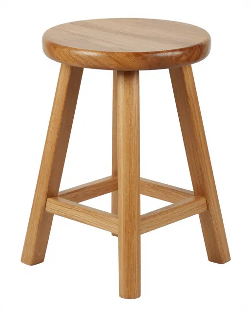 A natural wood three-legged stool with a round seat sits isolated on a pure white studio background