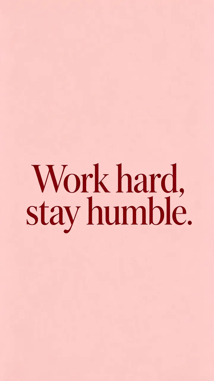 Centered deep burgundy serif text reading "Work hard, stay humble." on a blush pink vertical phone wallpaper background