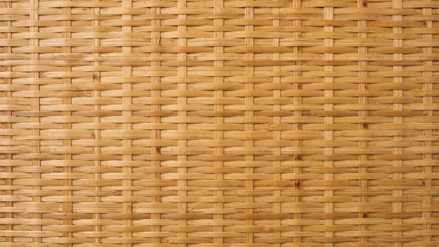 Top view close-up of a tight over-under interlaced woven bamboo mat filling the full frame