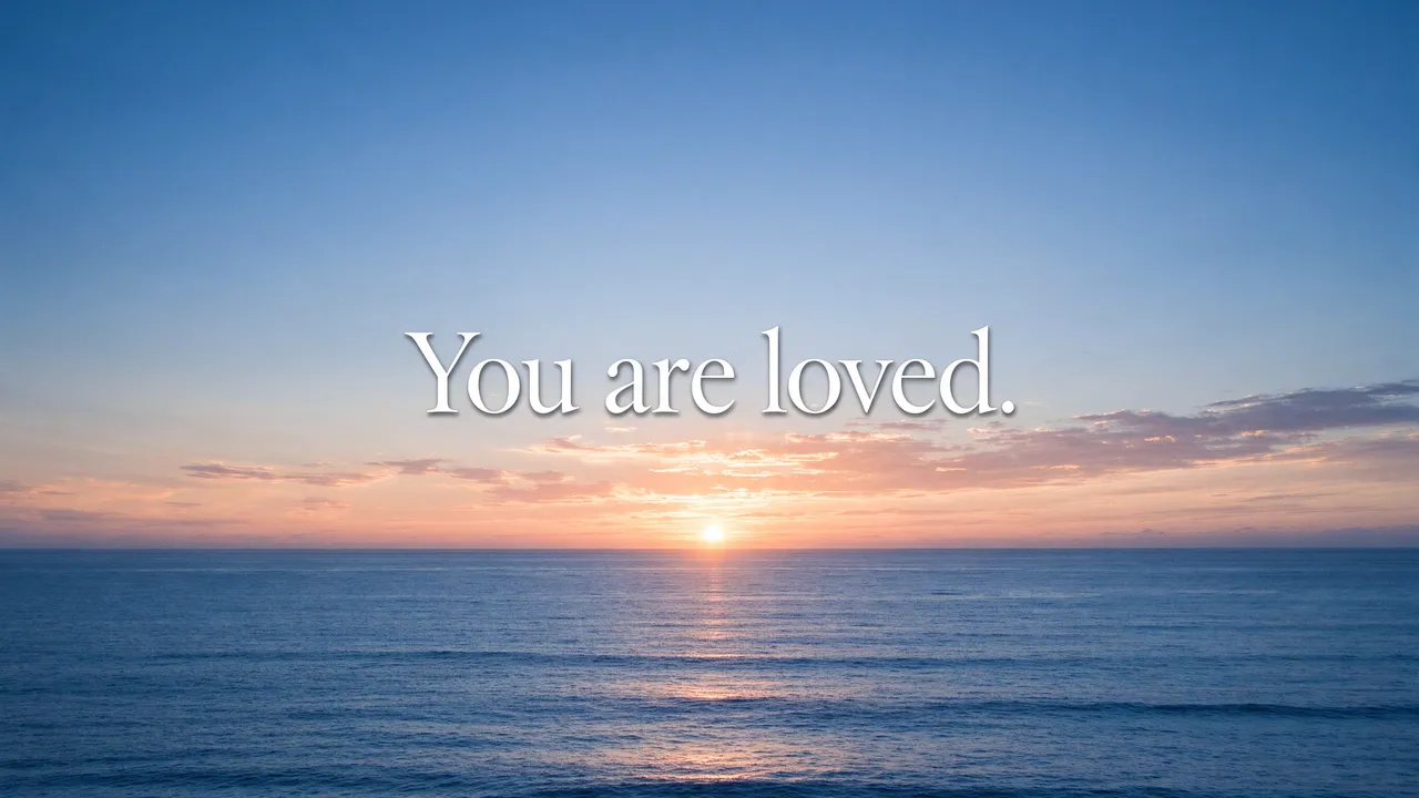 Calm ocean sunrise with soft white serif text reading "You are loved." centered in the sky.