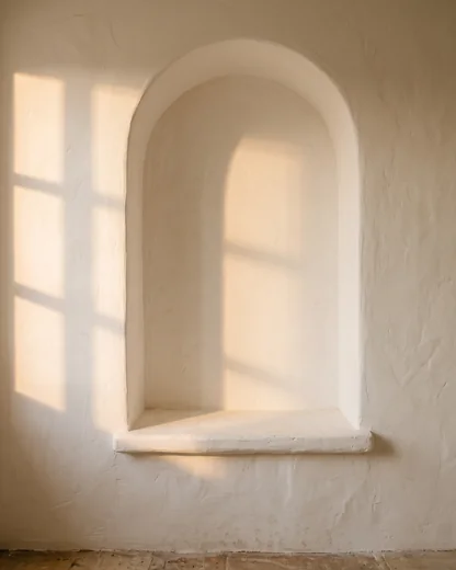 Reference 3: an empty arched niche in a plaster wall, in late sun
