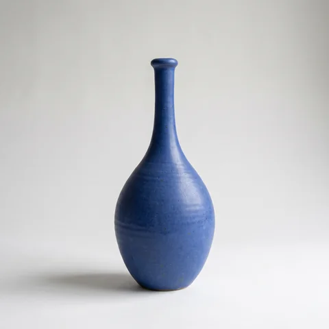 Reference 1: a cobalt-blue ceramic vase on a grey backdrop